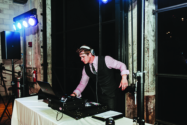 Minnesota wedding DJ service Day One DJ performs at a wedding.