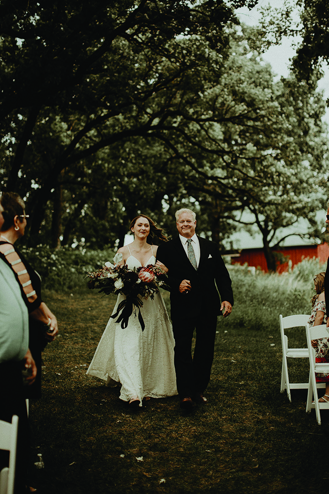 Heidi's father walks her down the aisle at Almquist Farm