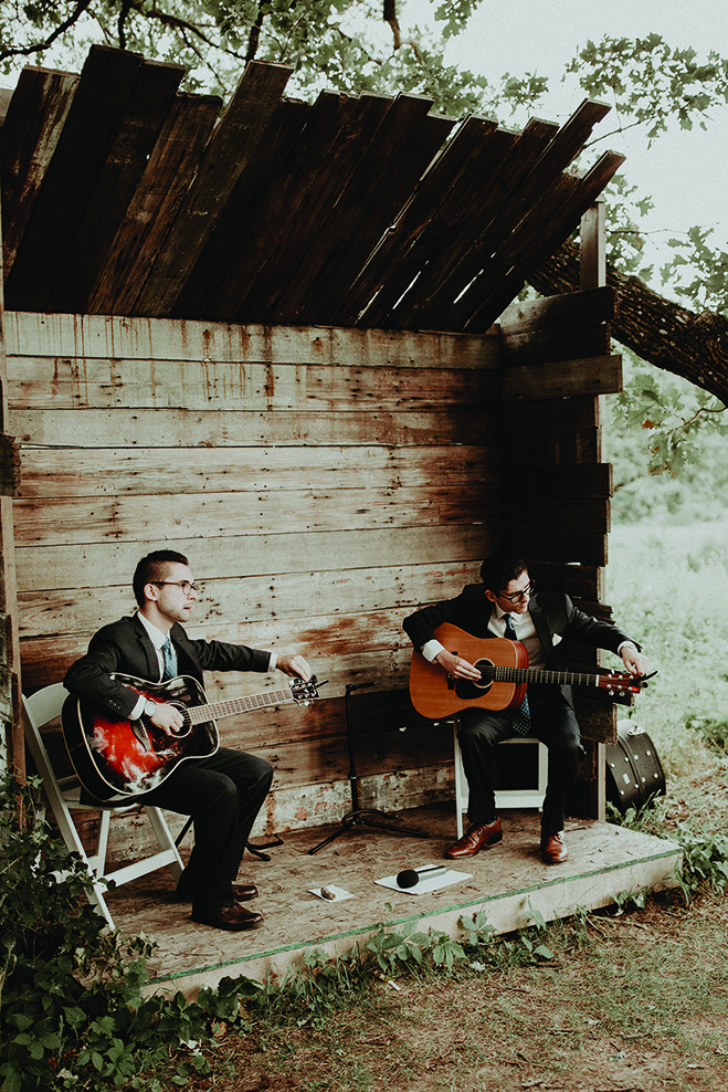 Two guitarists play at Heidi and Erik's wedding in Almquist Farm.