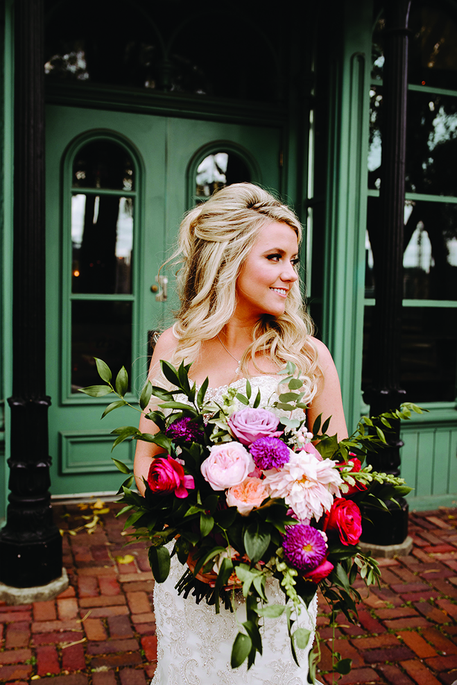 Molly shows off her bouquet on St. Anthony Main