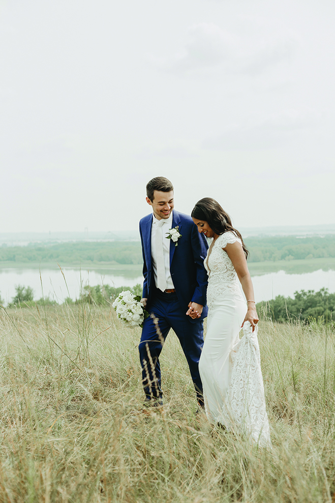 Ruwani and Zach walk hand-in-hand at The Hutton House.