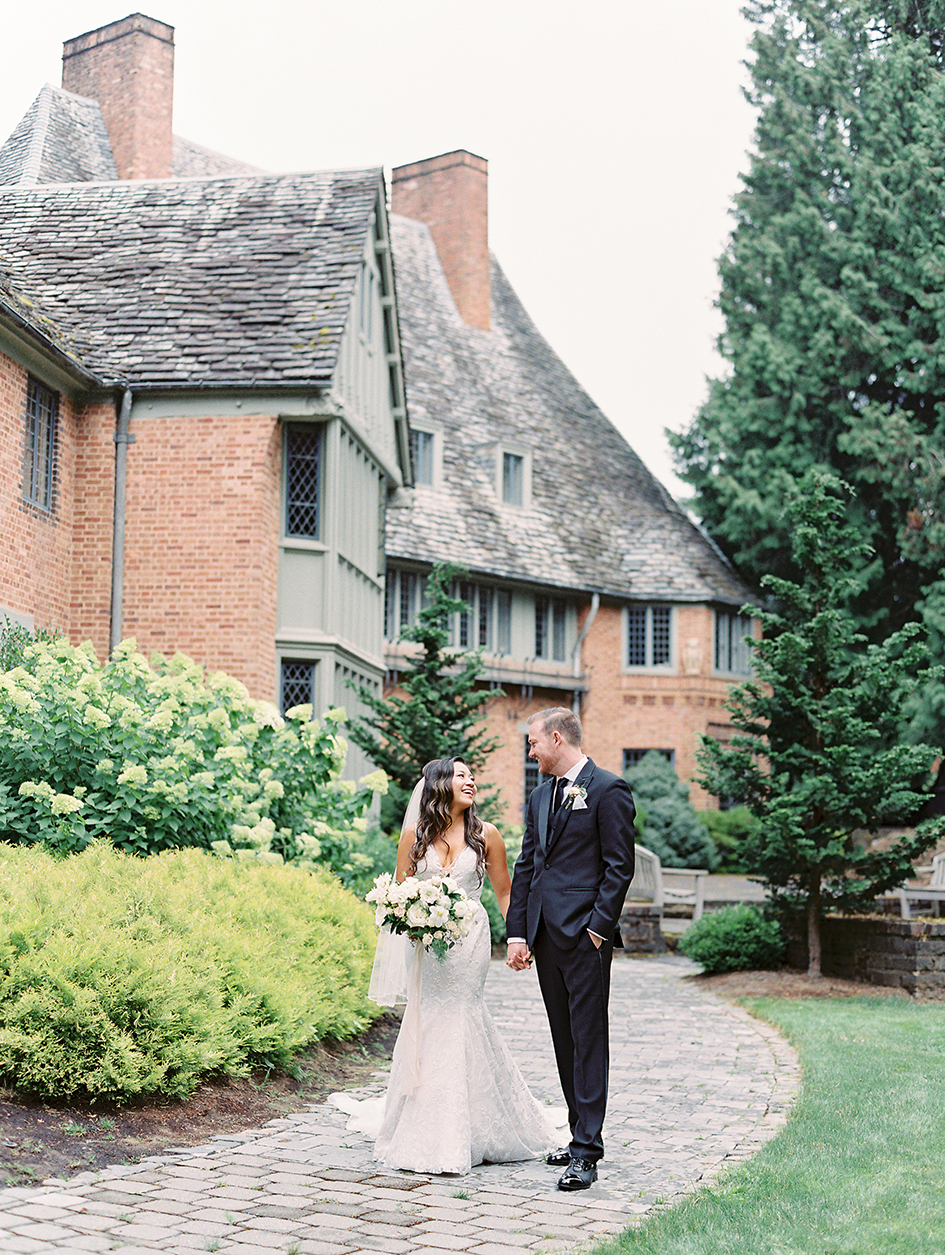 Stephanie and Nyles walk the grounds during their Fir Acres Estate Gardens wedding