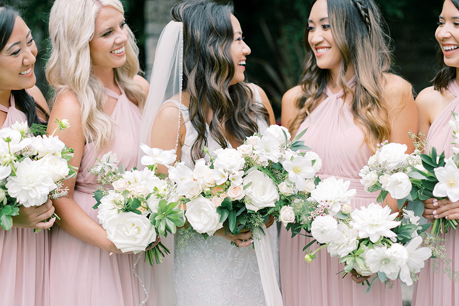 Stephanie and her bridesmaids show off their bouquets.