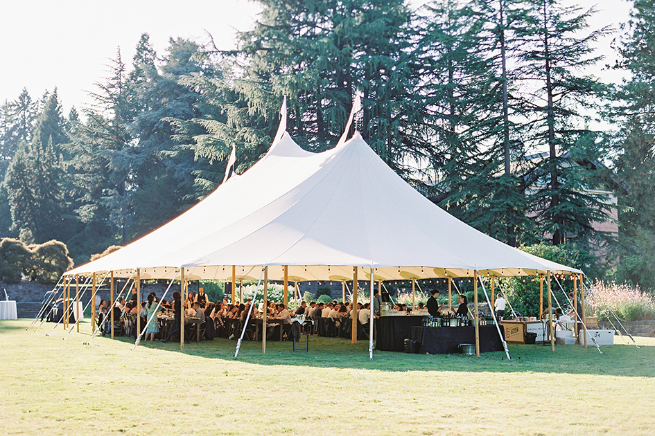 The dinner tent at Fir Acres Estate Gardens filled with guests.