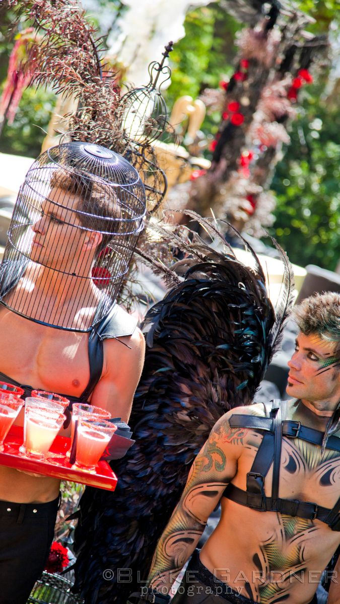 "Devil" waiters passing out smoking cocktails at "Heaven and Hell" ceremony