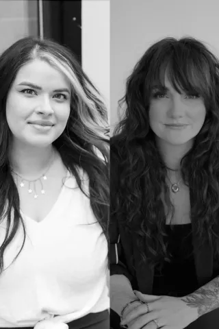 Black and white portrait of Gemma-Louise Sherman and Brittany Desmondez, bridal hair specialists with Bridal Beaut, showcasing their expertise in wedding hairstyling.