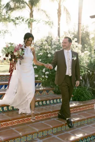 Hamida and brett descend a staircase at La Lomita Ranch