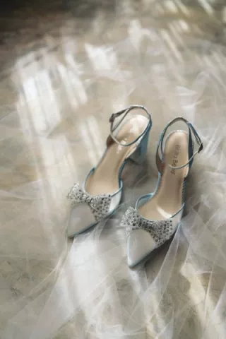 Model and pair of silver bridal Bella Belle Shoes from the Champagne Era collection