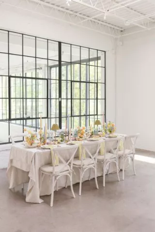 Light and airy tablescape featuring a palette of soft pastels, local blooms and vegetable details at The Whim