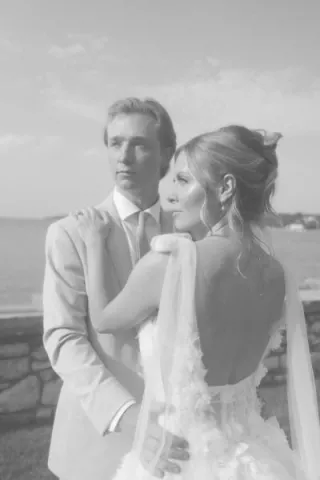 Bride and groom pose on the grounds of Alpine Resort