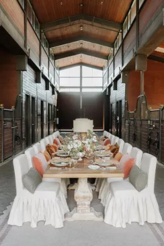 Earthy tablescape in the midst of a horse barn at TERI campus of life