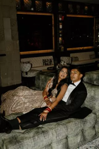 Nikita and Sahil pose before their reception in their opulent attire