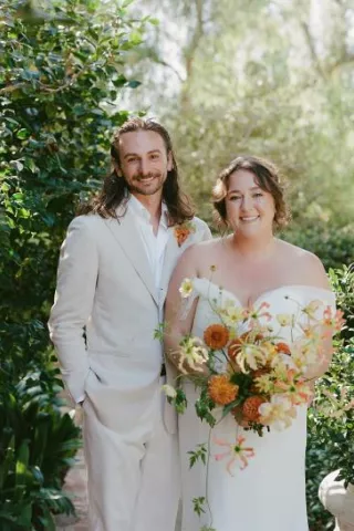 Bride and groom pose, smiling side by side in Santa Fe wedding day at private estate