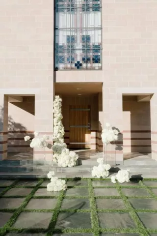 Cloudlike blooms form a modern altar on the lawn of new venue The Bird Estate