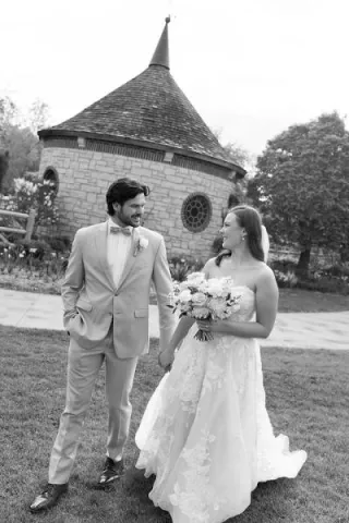 Madelyn and Andrew glance at each other and walk on their wedding day