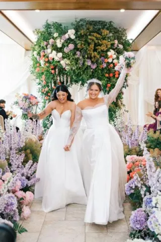 Enya and Elle walk back down the aisle after I do's at Equestria West