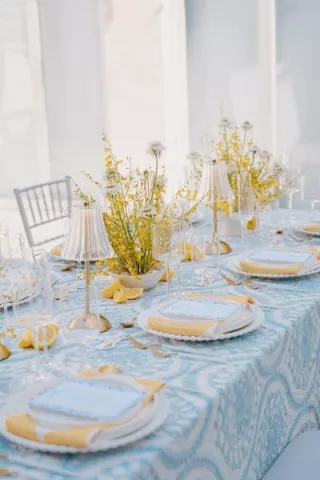 Amalfi Coast-inspired tablescape featuring bright yellow and blue hues