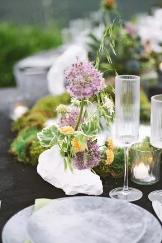 Place setting on moody detail-oriented tablescape and Grand View Malibu 