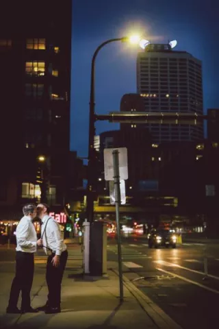 Matt and Luke embrace on the streets of Minneapolis
