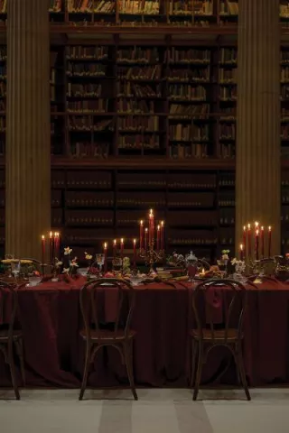 Candlelit reception table in wine hues at Avalon
