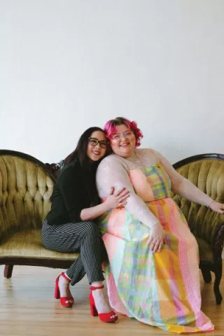 Owners of Honeybee Bridal pose for a photo 