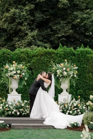 Paige and Nick seal their vows with a kiss in outdoor ceremony at Columbia Collective