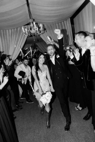 Bride and groom make their grand exit in fashion-forward wedding day at Ever After Ranch