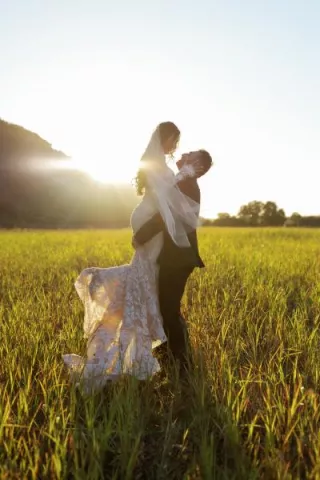 Morgan and Anthony pose in the mustard field of Tar Creek Ranch on their wedding day