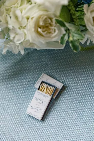 Custom matchbooks on blue tablecloth