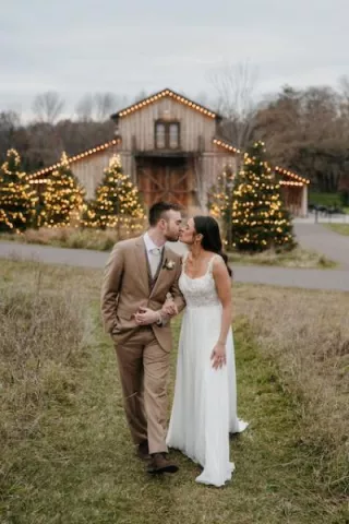 Madeline and Aaron Share a Kiss in front of Creekside Farm