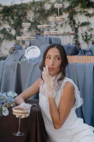 Model poses, wiping her mouth after eating a sweet treat