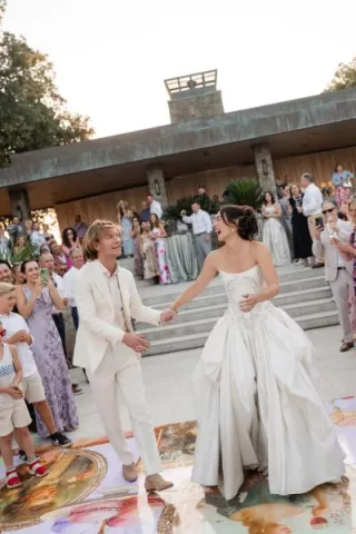 Sarina and Travis grace the custom dance floor of their Rococo-inspired wedding