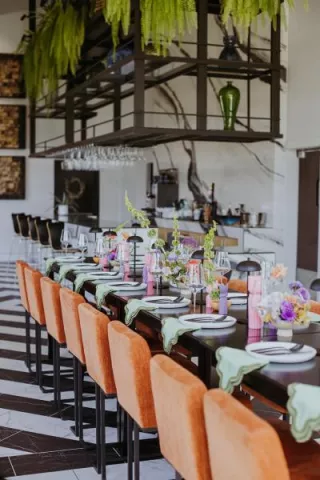 Modern and funky imagined reception scene featuring pastel hues at District Wine Bar