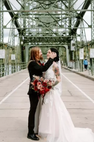 Brittany and Daryian Share an Intimate Moment Post-Wedding on the Stillwater Lift Bridge