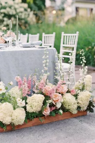 Bright florals in front of classic tablescape at Fox Hollow Farms