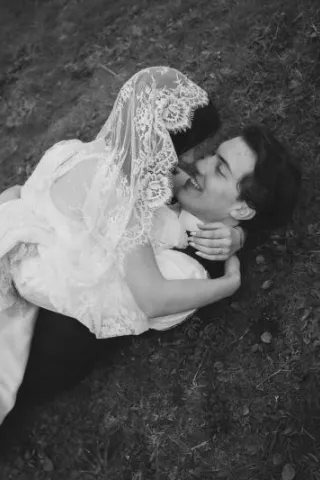 Mykayla and Jake roll in the beach grass during their elopment