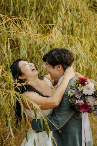 Patty and David embrace and share laughter on the grounds of Twin Willows