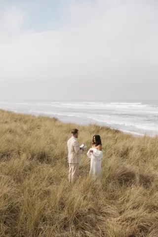 Bride and groom exchange vows in oceanside elopement