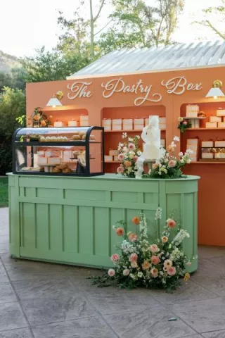 Colorful pastry box escort card display 