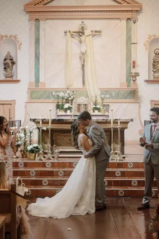 Sadie and Jack kiss at the altar after exchanging vows