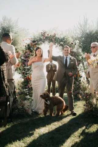 Sarah, David and their dog Miles celebrated their special day with bright sunshine and flowers at Stonewall Ranch.