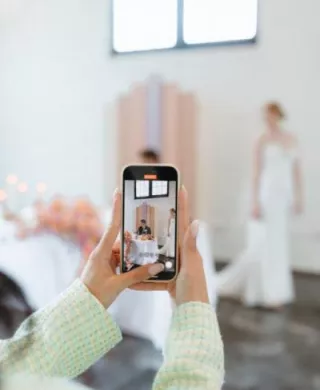 Content creator taking candid video of a bride