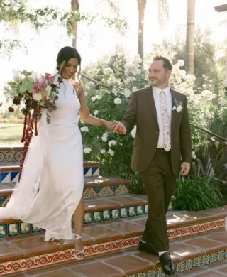 Hamida and brett descend a staircase at La Lomita Ranch