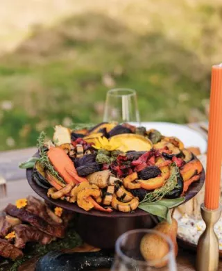 Fall inspired outdoor tablescape with a seasonal Chowgirls menu