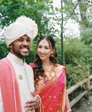 Mady and Sahil smile and pose in their wedding day attire (day one)