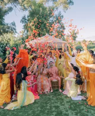 Bride and groom are showered in rose petals in celebratory opening evening for wedding weekend at Grand Hyatt Scottsdale REsort