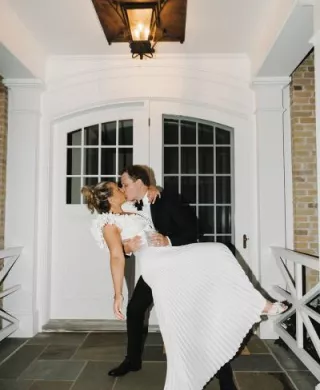 Jack dips Abby into a kiss in their lakeside wedding day at a private residence