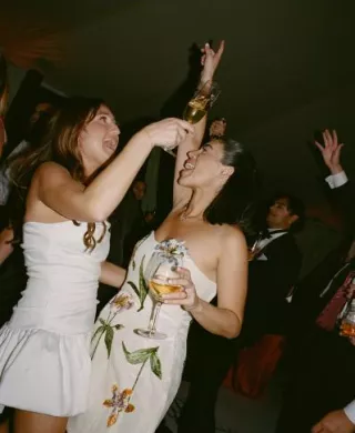 Natalie and Lindsay in their after party attire on their award winning wedding day