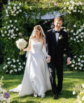 Bride and groom walk back down aisle at the end of enchanted garden wedding ceremony at The Lodge at Malibou Lake