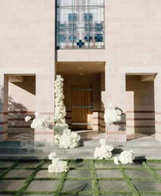 Cloudlike blooms form a modern altar on the lawn of new venue The Bird Estate